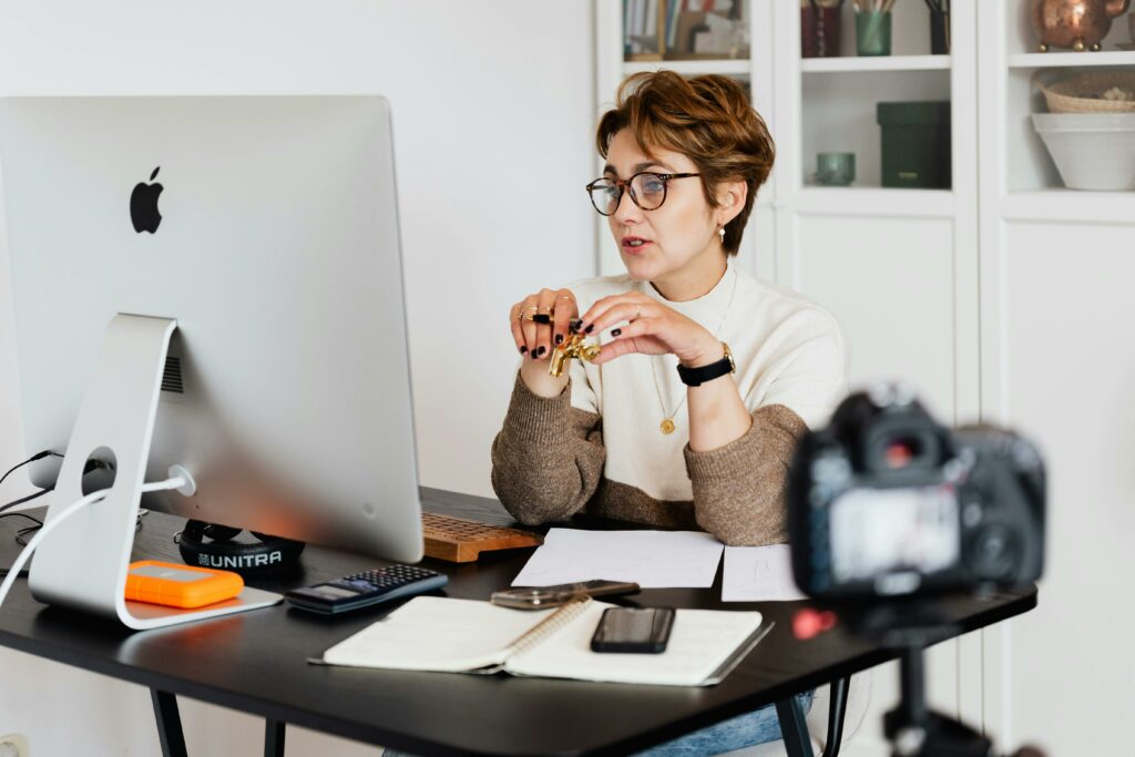 pexels-photo-4491461-4491461 Confident elegant lady in eyeglasses hosting webinar